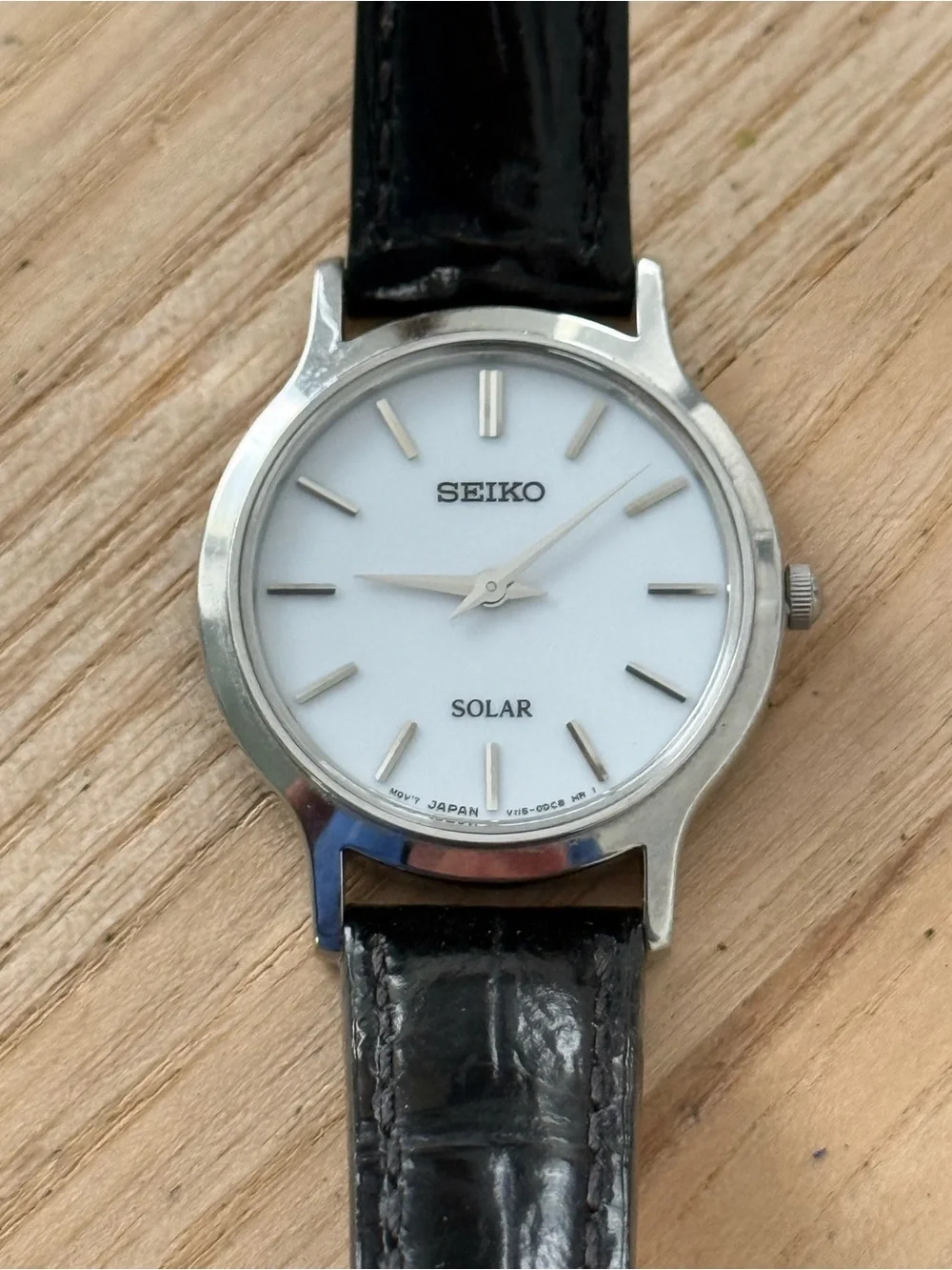 Seiko Solar Ladies Watch White Round Dial Black Leather Strap Stainless Case